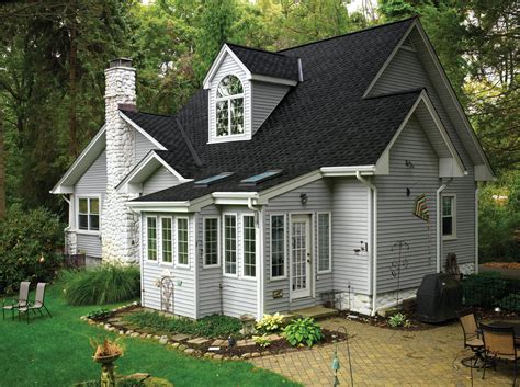 grey house with metal roof|gray homes with black roofs.